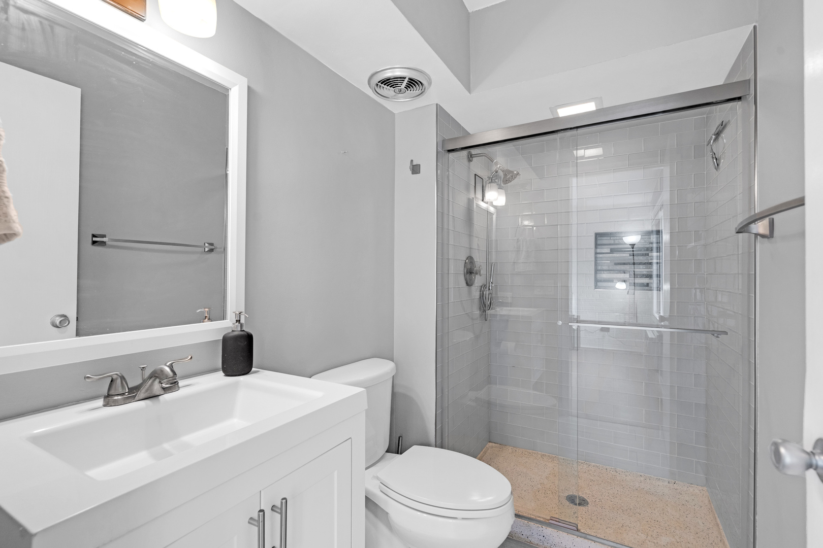 659 South Des Plaines River Road, Unit 2A Des Plaines, IL 60016 - Photo 8 of 28 a bathroom with a sink mirror toilet and shower