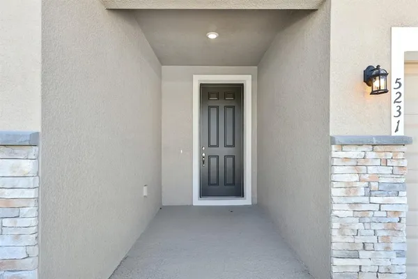 a view of a hallway with windows