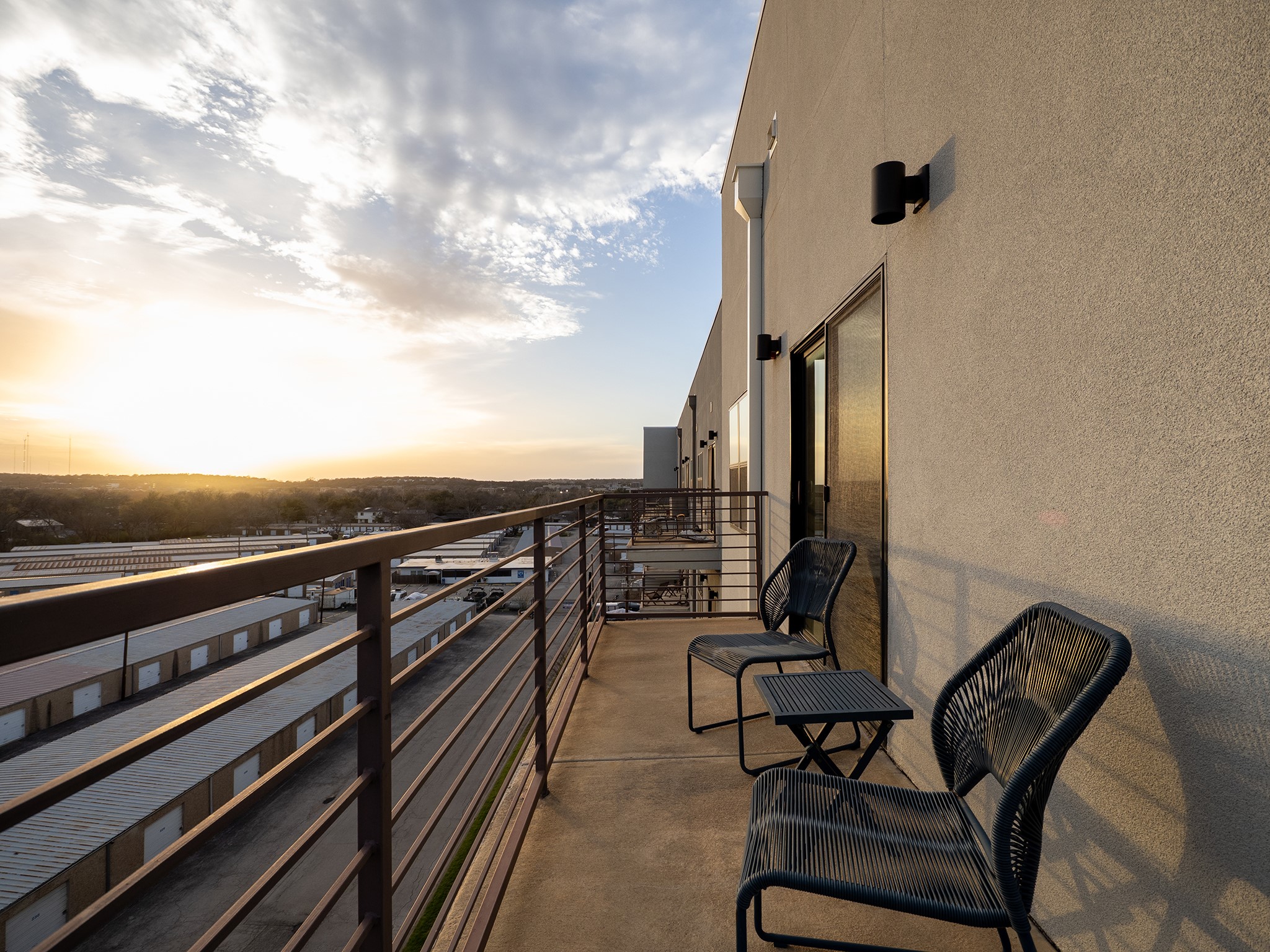6444 Burnet Road, Unit 509 Austin, TX 78757 - Photo 21 of 32 Enjoy evening panoramas and fresh air from this private concrete balcony, an ideal retreat.