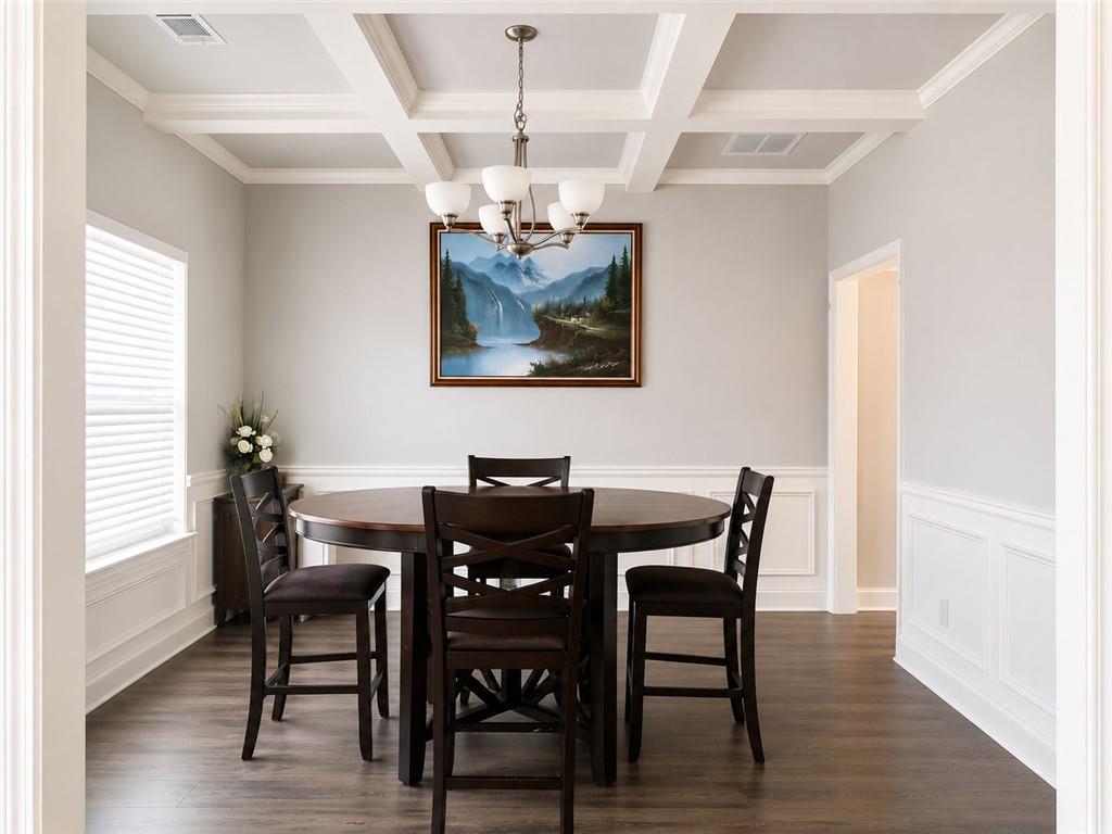 3359 Elkhorn Ridge Run Dacula, GA 30019 - Photo 6 of 35 a view of a dining room with furniture and wooden floor