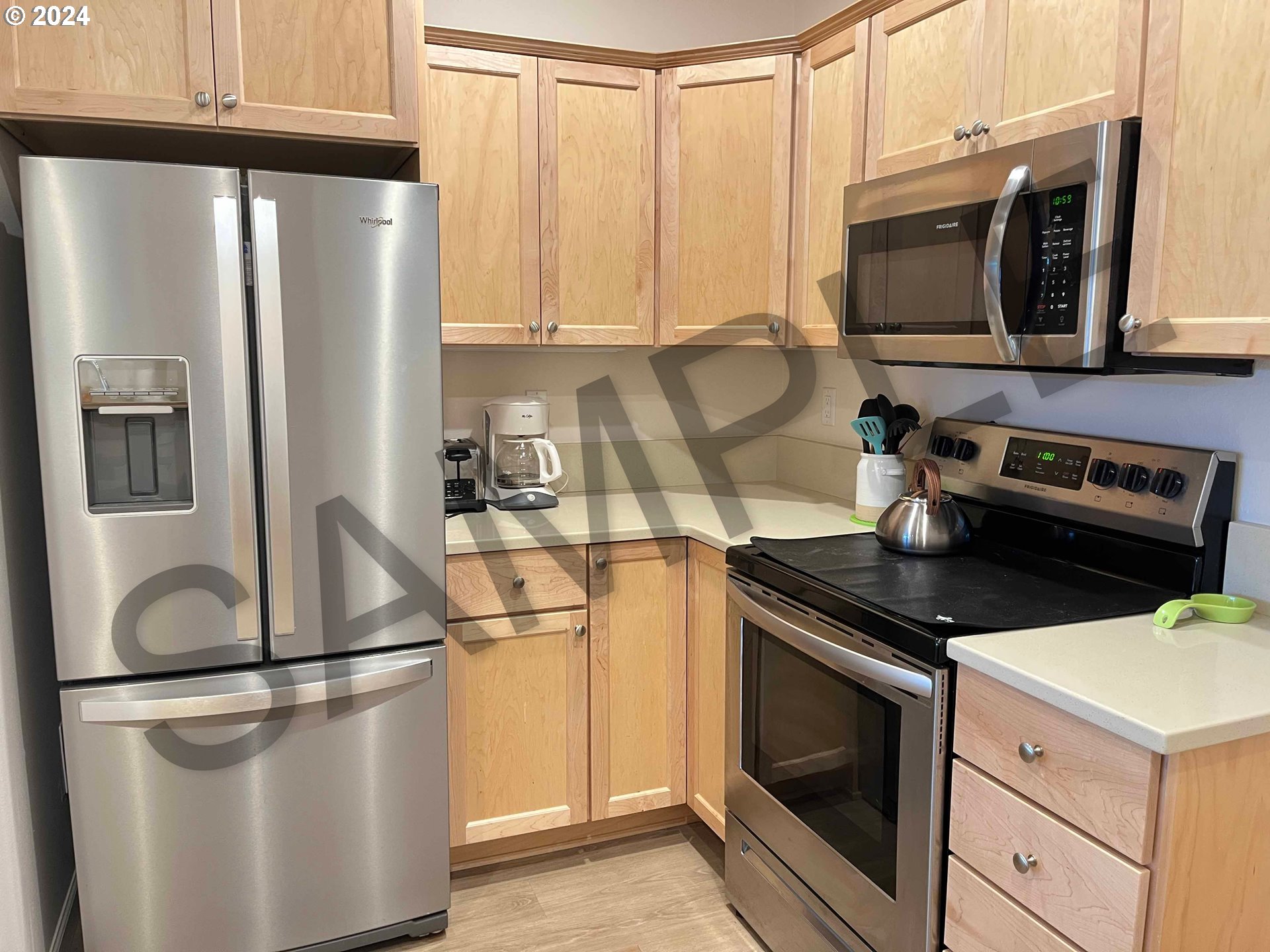 1587 37th Street Florence, OR 97439 - Photo 8 of 47 a kitchen with stainless steel appliances granite countertop a refrigerator stove and microwave