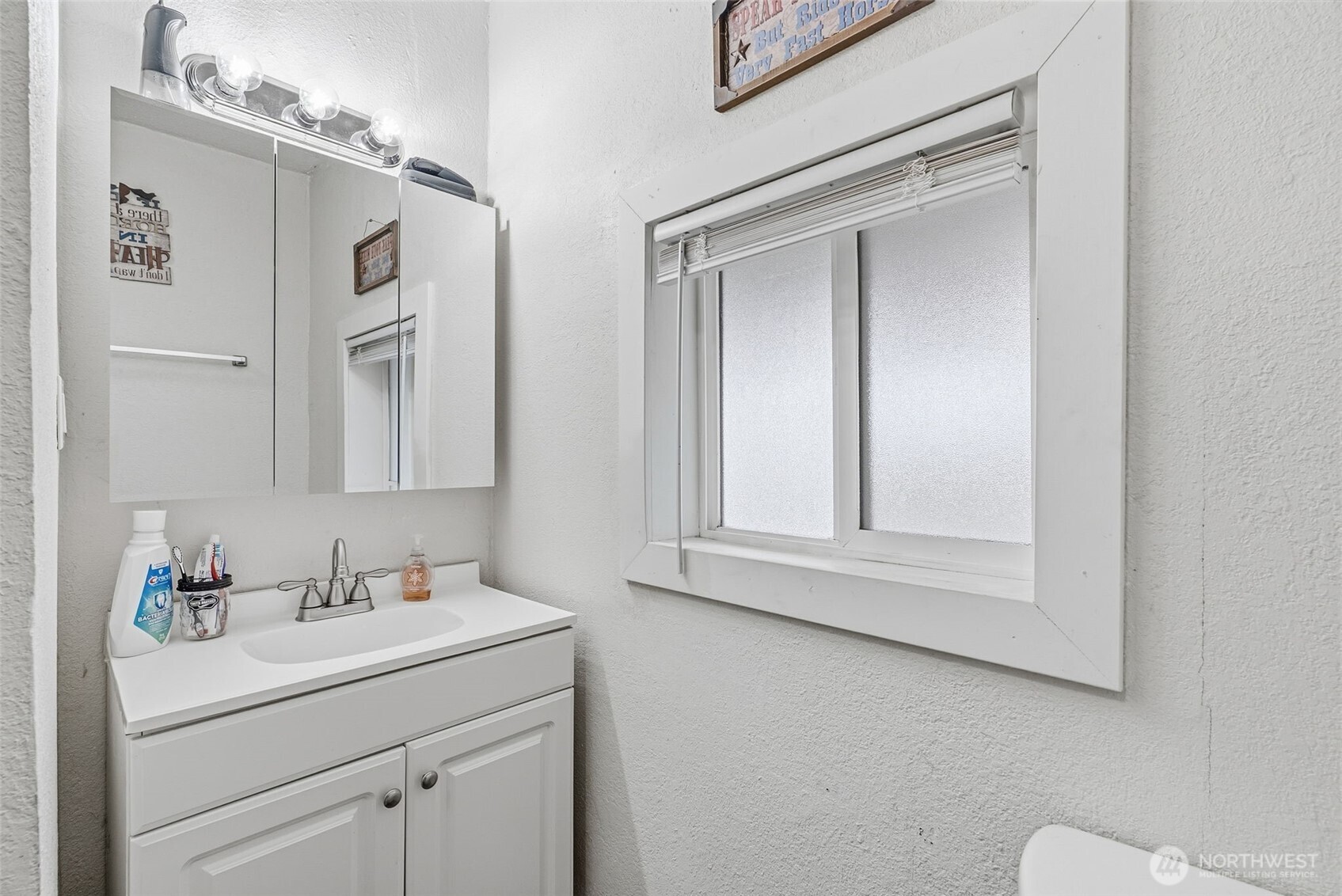 228 Holcomb Spur Road Kelso, WA 98626 - Photo 11 of 23 a bathroom with a sink vanity and mirror