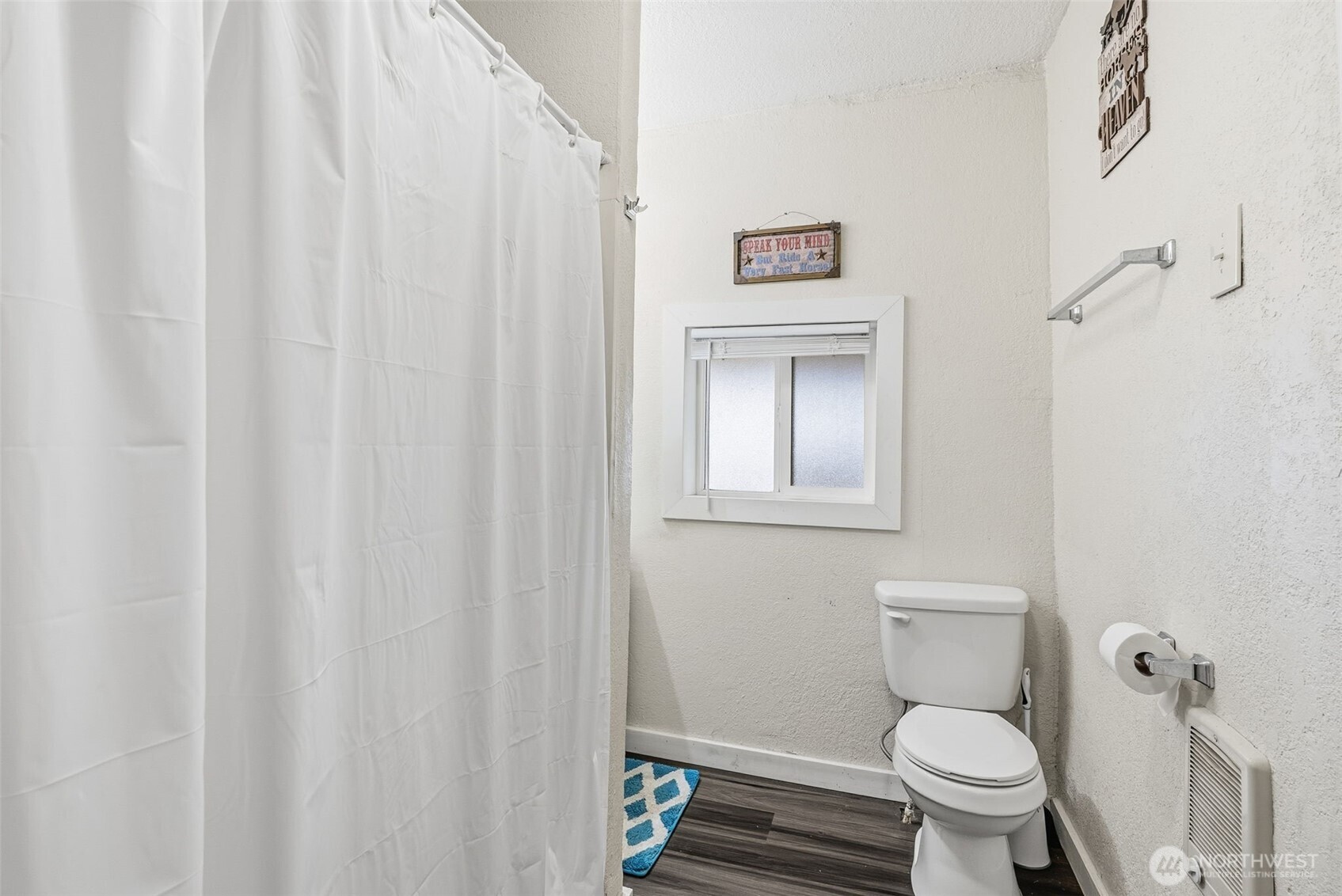 228 Holcomb Spur Road Kelso, WA 98626 - Photo 12 of 23 a white toilet sitting next to a small bathroom