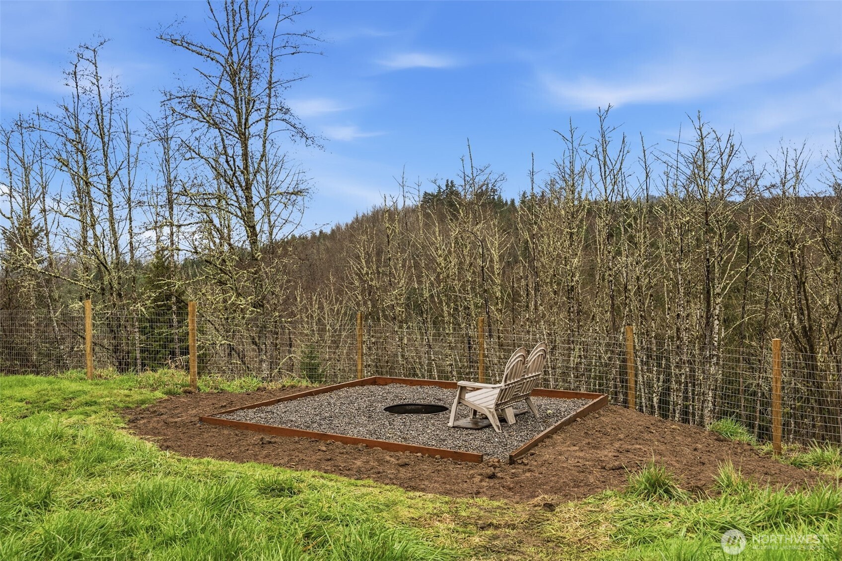 228 Holcomb Spur Road Kelso, WA 98626 - Photo 20 of 23 a view of a backyard with wooden fence