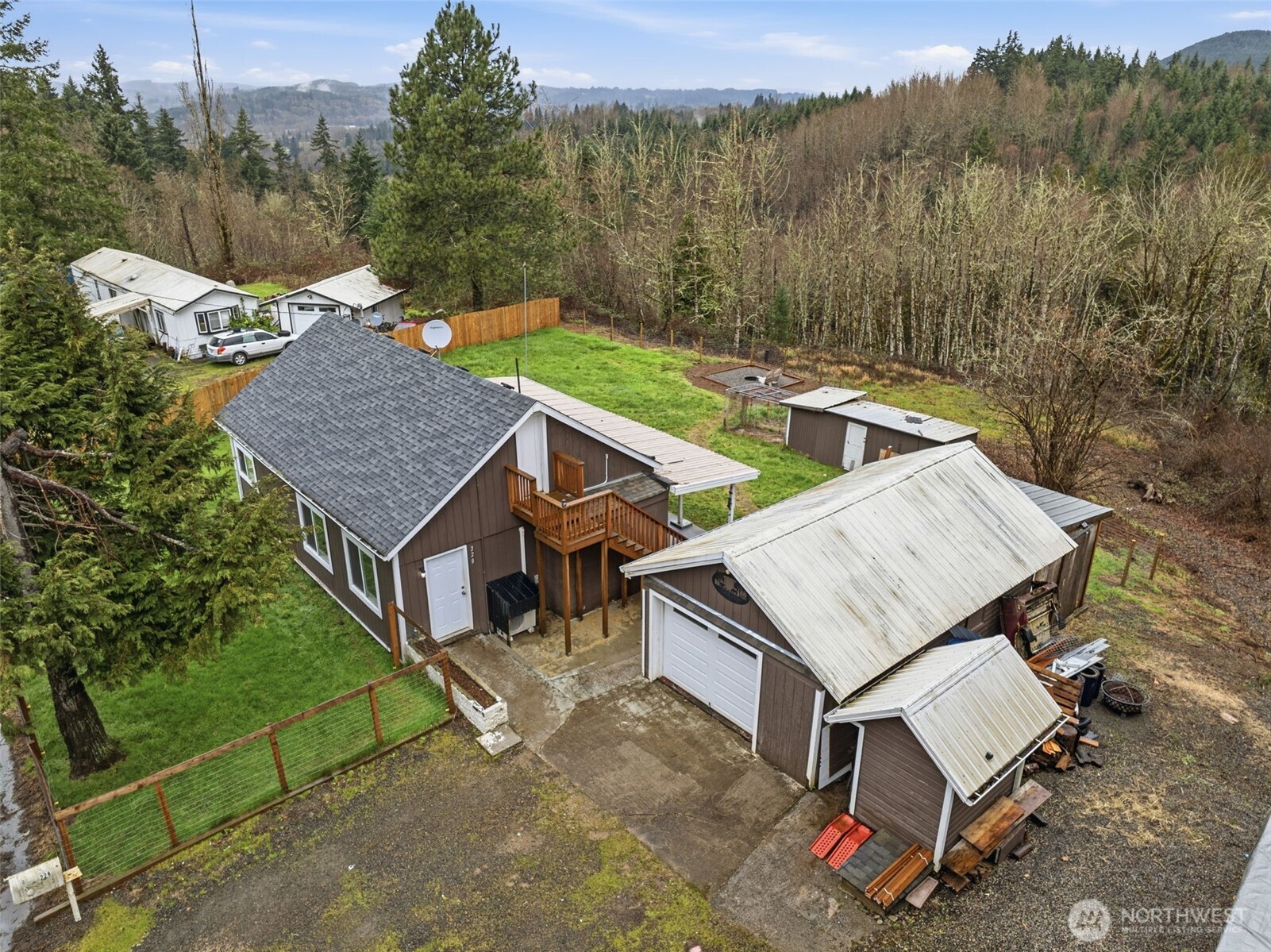 228 Holcomb Spur Road Kelso, WA 98626 - Photo 2 of 23 an aerial view of a house with a yard