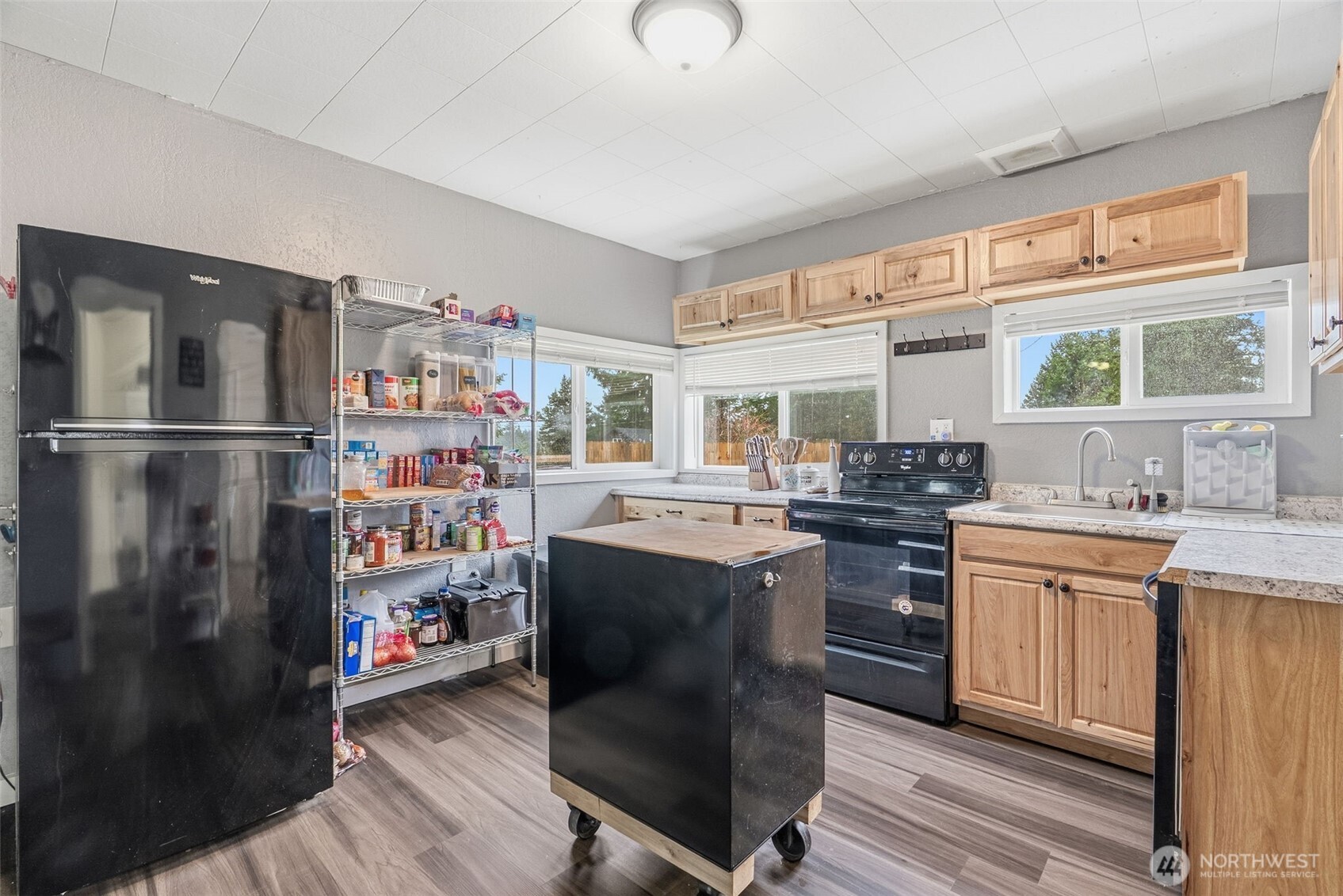 228 Holcomb Spur Road Kelso, WA 98626 - Photo 8 of 23 a kitchen with stainless steel appliances granite countertop a refrigerator a sink dishwasher a stove and white countertops with wooden floor