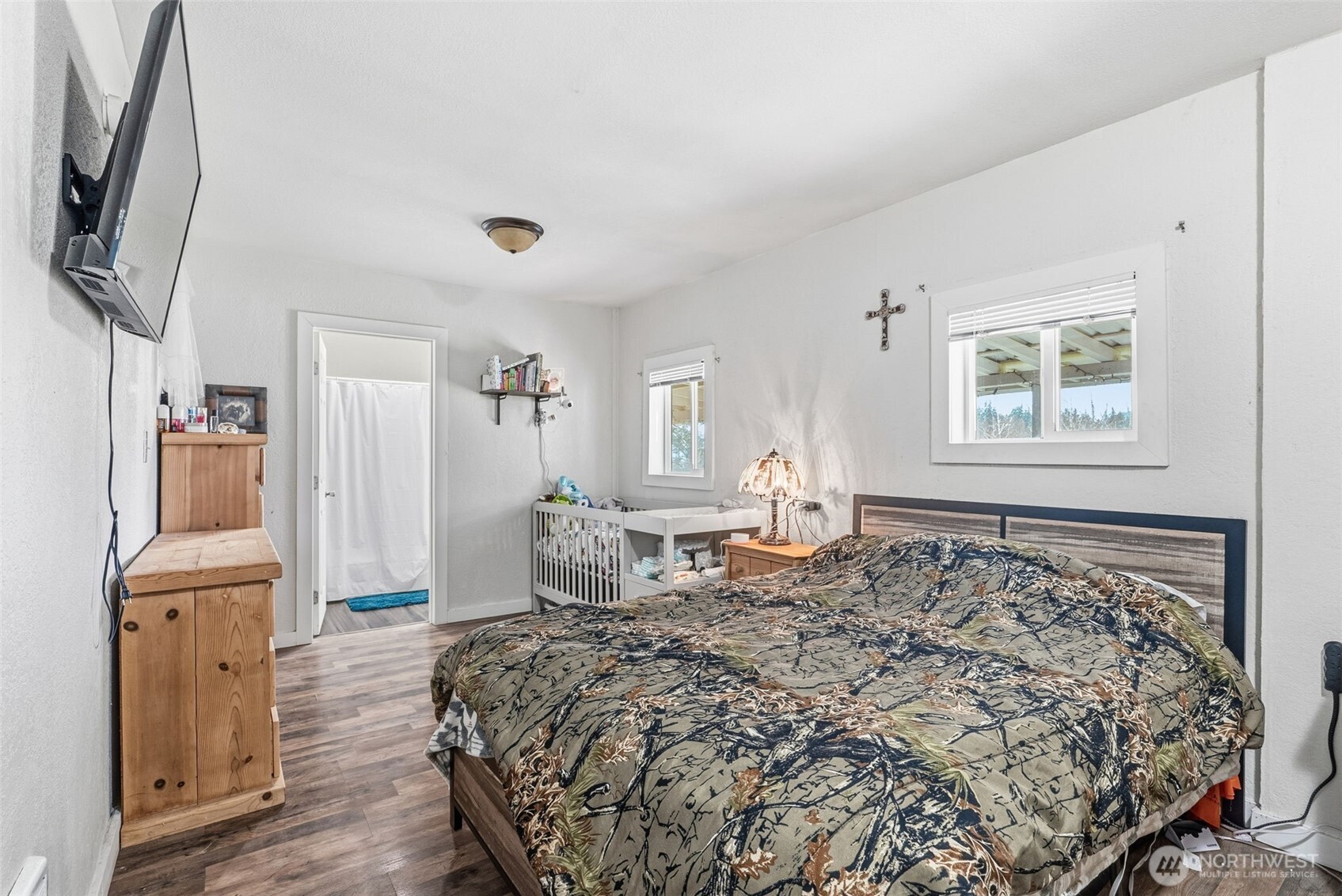 228 Holcomb Spur Road Kelso, WA 98626 - Photo 9 of 23 a bedroom with a bed and a flat screen tv