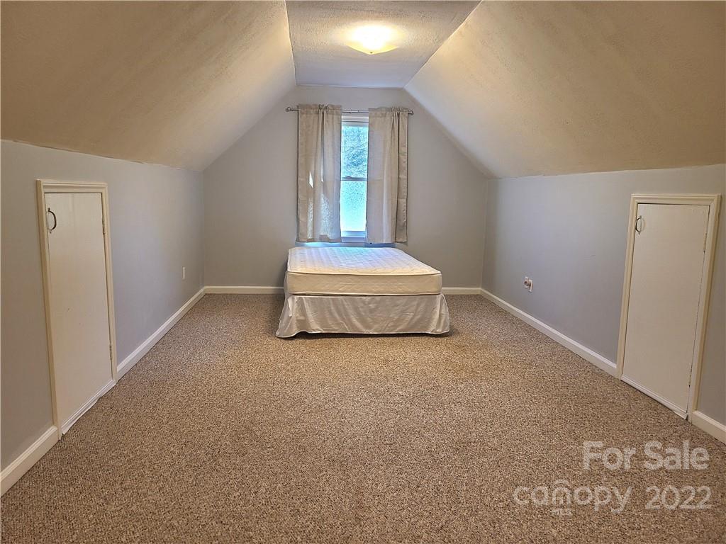 24955 Ridgecrest Road Locust, NC 28097 - Photo 16 of 22 a view of a livingroom with wooden floor and window
