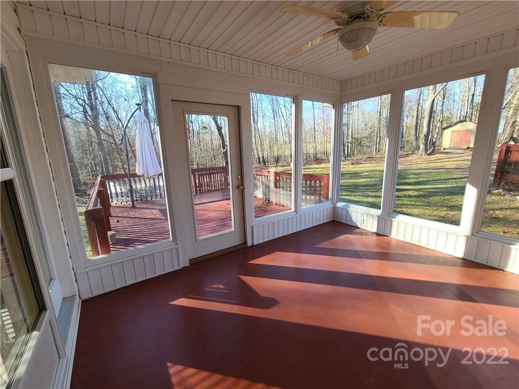 24955 Ridgecrest Road Locust, NC 28097 - Photo 18 of 22 a view of a room with wooden floor and windows