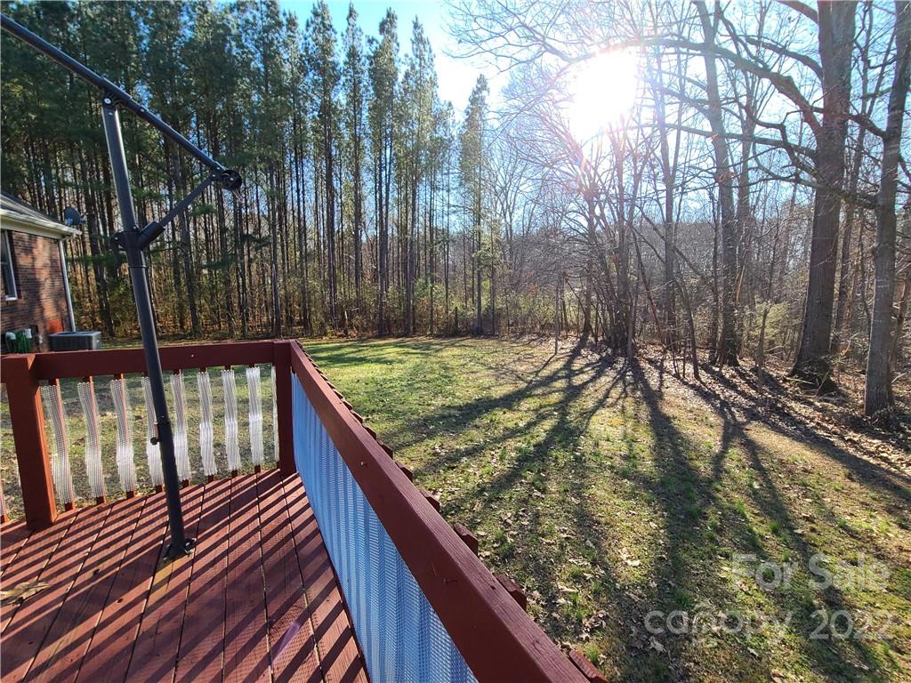 24955 Ridgecrest Road Locust, NC 28097 - Photo 20 of 22 a view of balcony with wooden floor and fence