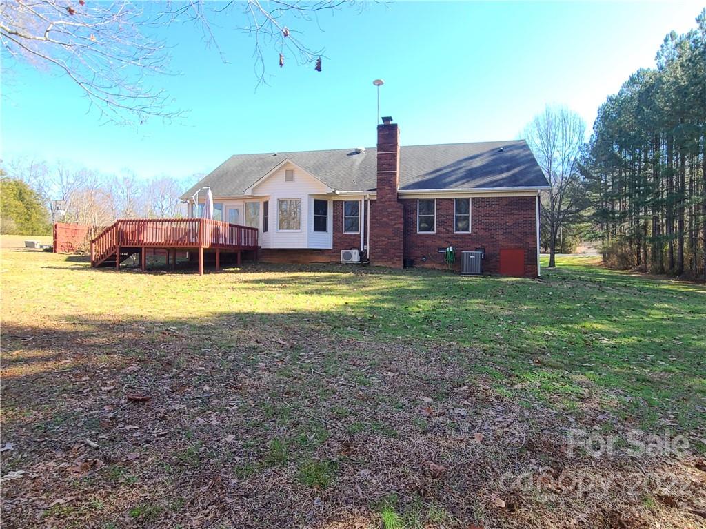 24955 Ridgecrest Road Locust, NC 28097 - Photo 21 of 22 a view of a house with a yard