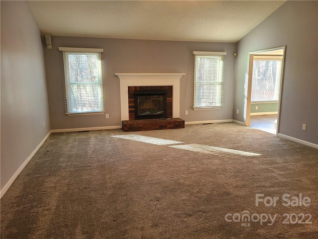 24955 Ridgecrest Road Locust, NC 28097 - Photo 4 of 22 an empty room with windows