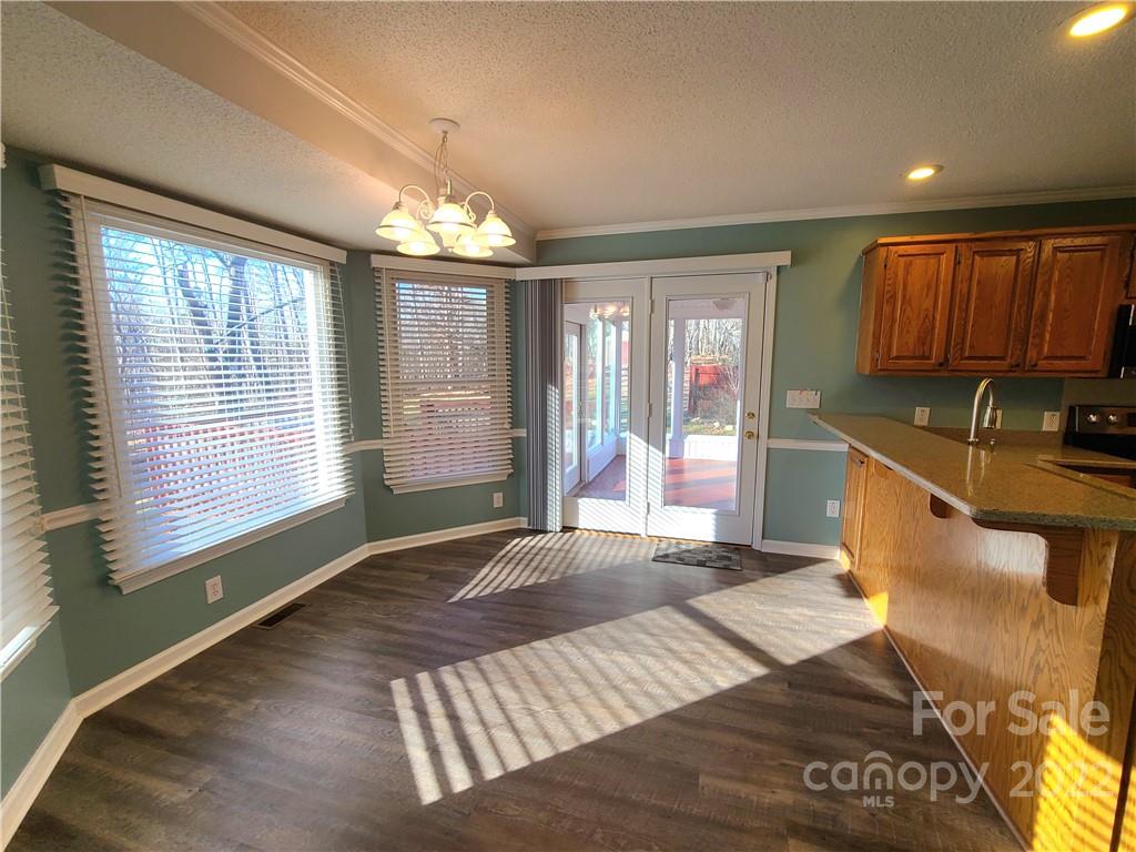 24955 Ridgecrest Road Locust, NC 28097 - Photo 5 of 22 a bedroom with a bed and a large window