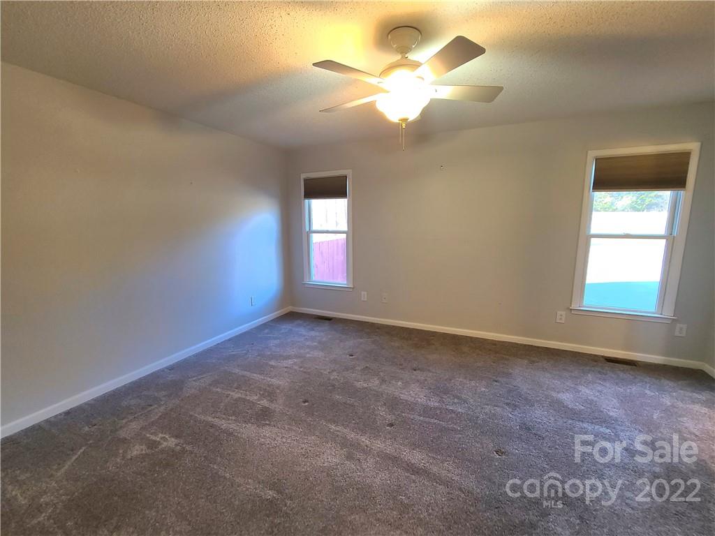 24955 Ridgecrest Road Locust, NC 28097 - Photo 8 of 22 an empty room with a window
