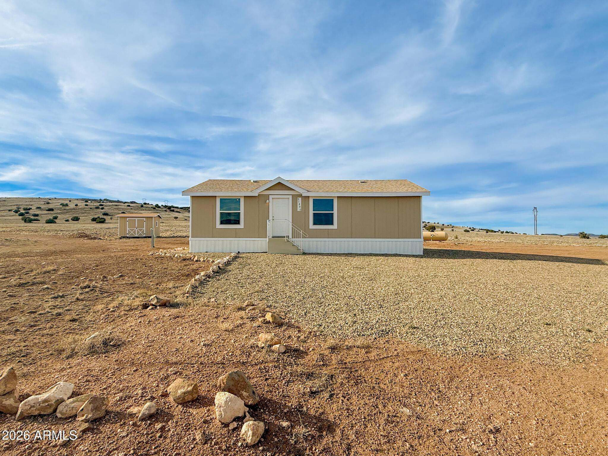 51880 North Gold Plains Road Seligman, AZ 86337 - Photo 2 of 24 a front view of house with ocean view