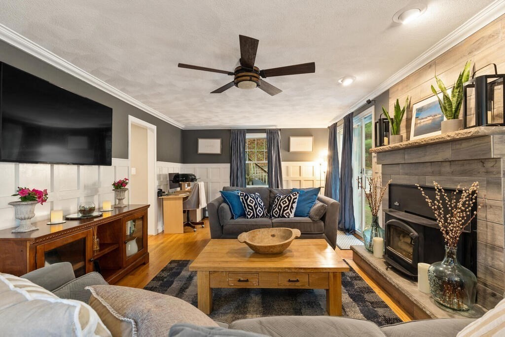 45 Keyes Road Westford, MA 01886 - Photo 4 of 38 a living room with furniture and a flat screen tv