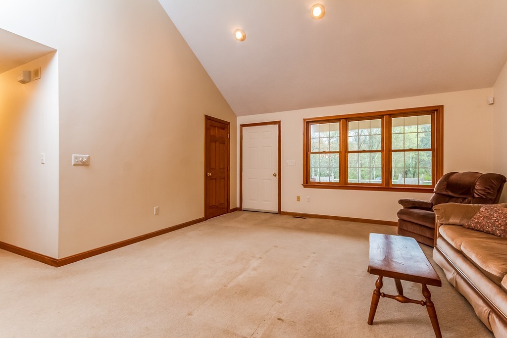 84 Little Turnpike Road Shirley, MA 01464 - Photo 11 of 30 a living room with furniture and a window