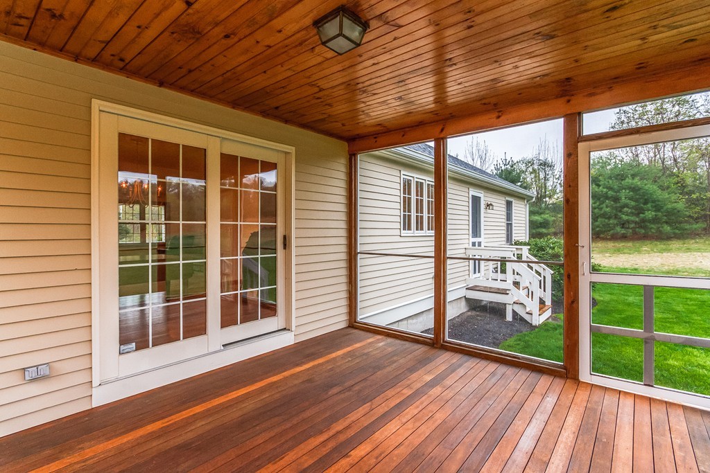 84 Little Turnpike Road Shirley, MA 01464 - Photo 13 of 30 a view of a porch with wooden floor