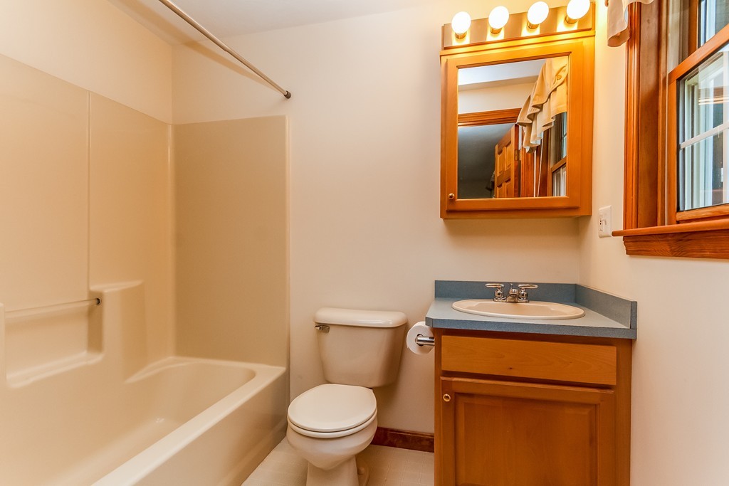 84 Little Turnpike Road Shirley, MA 01464 - Photo 17 of 30 a bathroom with a toilet sink and mirror