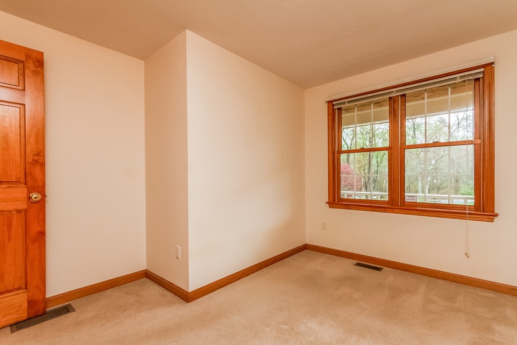 84 Little Turnpike Road Shirley, MA 01464 - Photo 19 of 30 a view of an empty room with a window