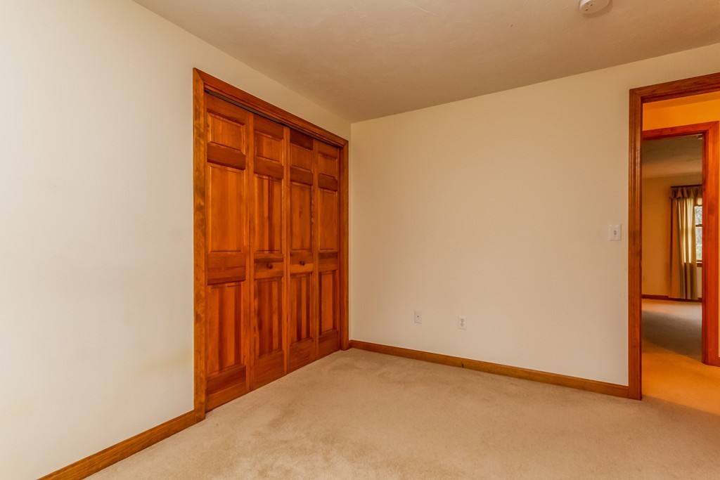 84 Little Turnpike Road Shirley, MA 01464 - Photo 20 of 30 a view of an empty room and wooden door