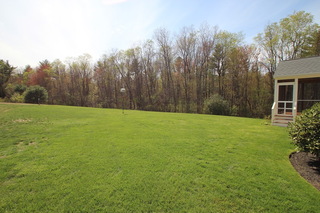 84 Little Turnpike Road Shirley, MA 01464 - Photo 28 of 30 a view of a yard with a house in the background
