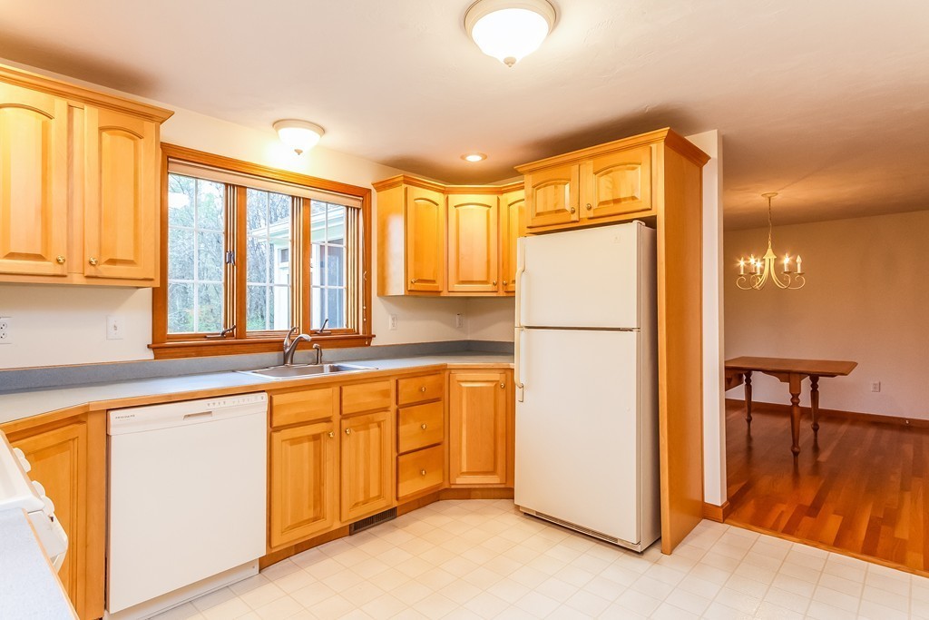 84 Little Turnpike Road Shirley, MA 01464 - Photo 4 of 30 a kitchen with stainless steel appliances granite countertop a refrigerator a stove and a sink with granite countertops