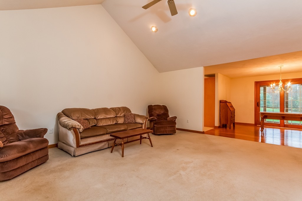 84 Little Turnpike Road Shirley, MA 01464 - Photo 10 of 30 a living room with furniture and a flat screen tv