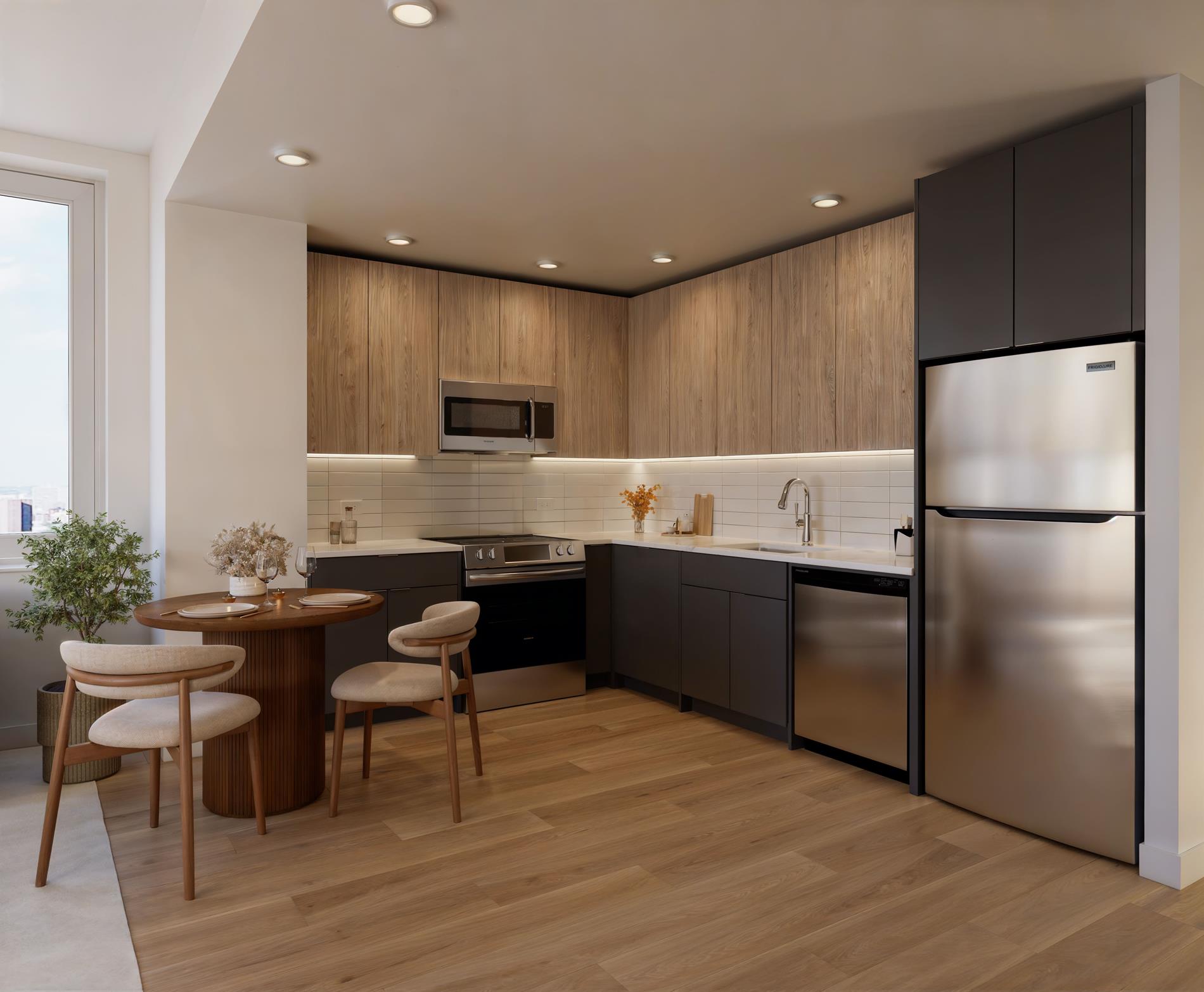 1440 Amsterdam Avenue, Unit 1616 Manhattan, NY 10027 - Photo 5 of 23 a kitchen with granite countertop a refrigerator stove microwave and cabinets