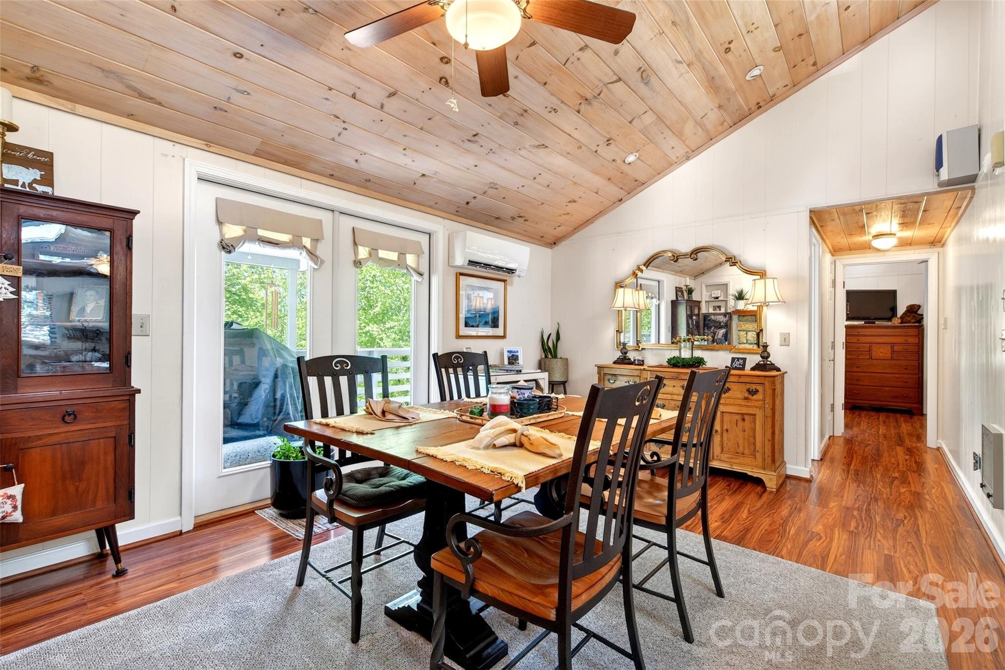 334 Harbor Lake Road Newland, NC 28657 - Photo 16 of 48 a view of a dining room with furniture window and wooden floor