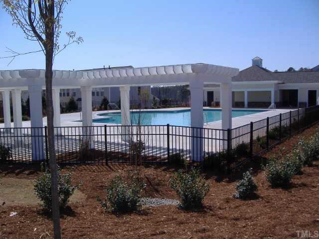 8717 Redcrest Place, Unit 113 Raleigh, NC 27617 - Photo 2 of 2 a house view with a garden