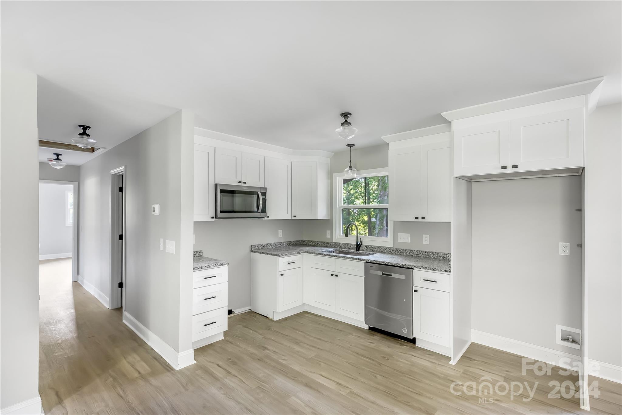 13320 Old Camden Road Midland, NC 28107 - Photo 12 of 22 a kitchen with stainless steel appliances a sink and a refrigerator