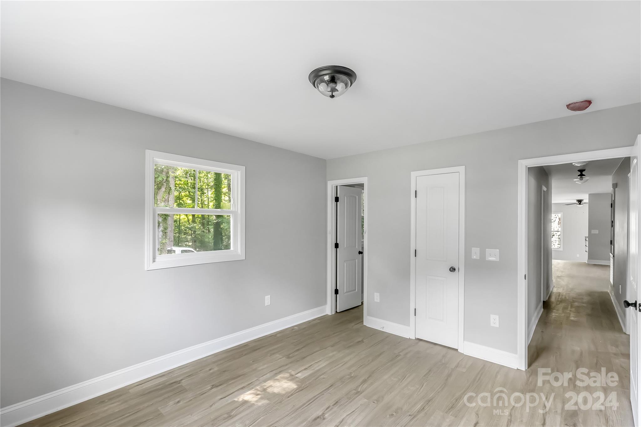 13320 Old Camden Road Midland, NC 28107 - Photo 20 of 22 a view of an empty room with wooden floor and a window