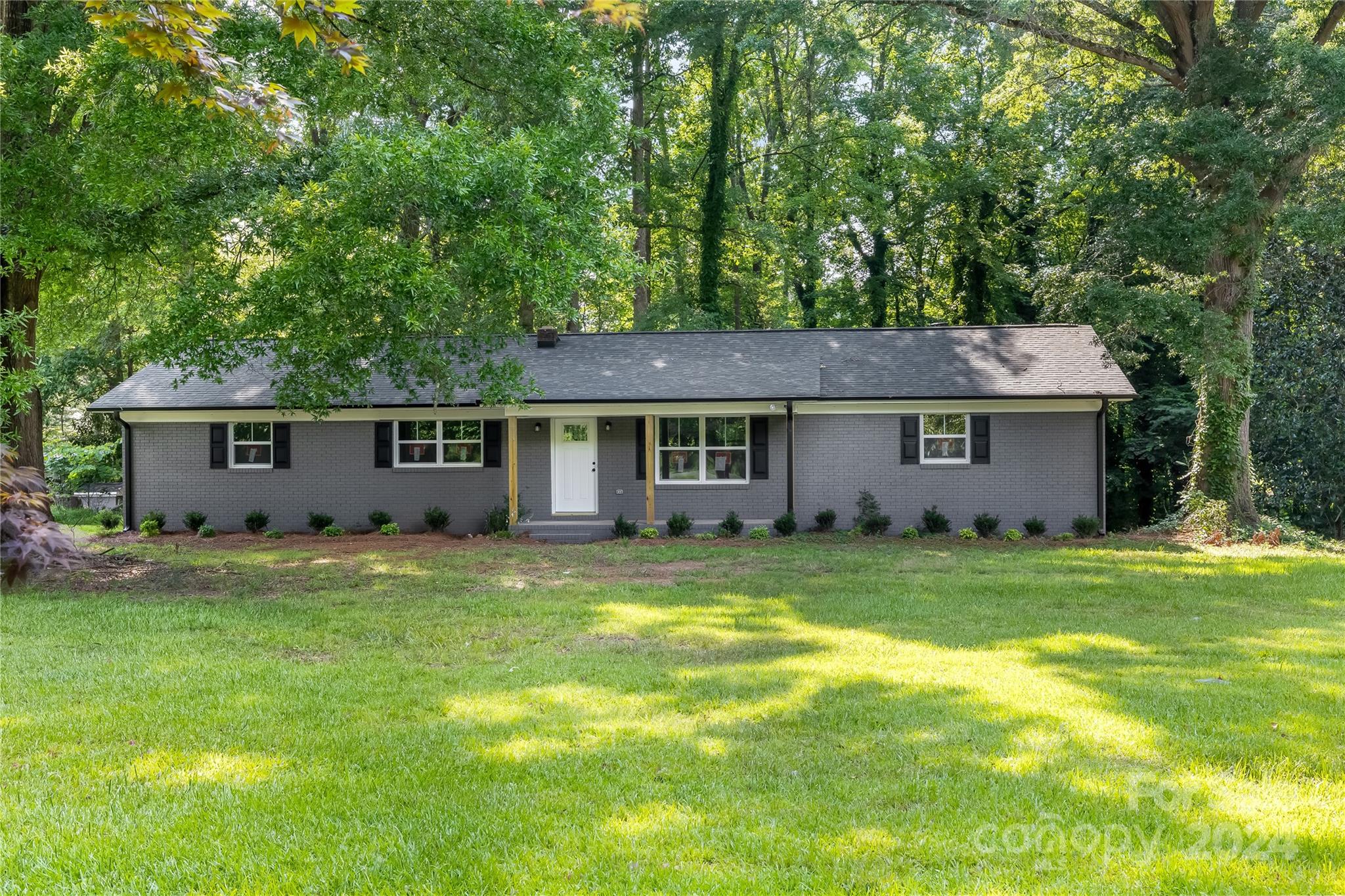 13320 Old Camden Road Midland, NC 28107 - Photo 2 of 22 a view of a yard with a house and a large tree