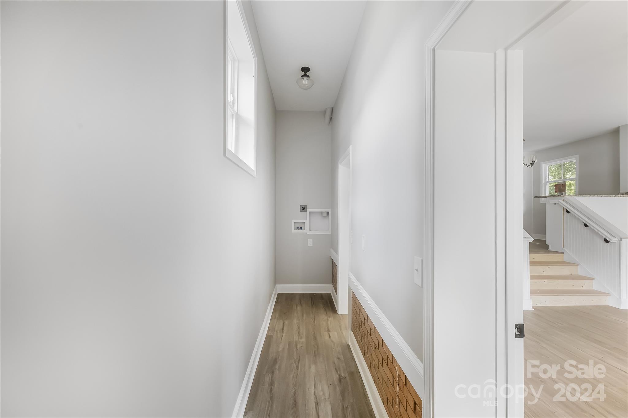 13320 Old Camden Road Midland, NC 28107 - Photo 6 of 22 a view of a hallway with wooden floor and staircase
