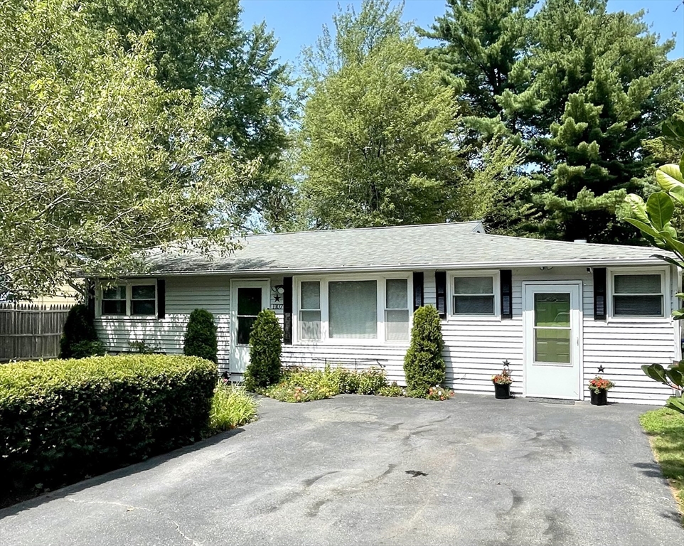 1107 Allen Street Springfield, MA 01118 - Photo 1 of 16 a front view of a house with a yard