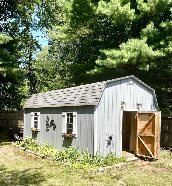 1107 Allen Street Springfield, MA 01118 - Photo 14 of 16 a view of a house with backyard outdoor seating area and garden