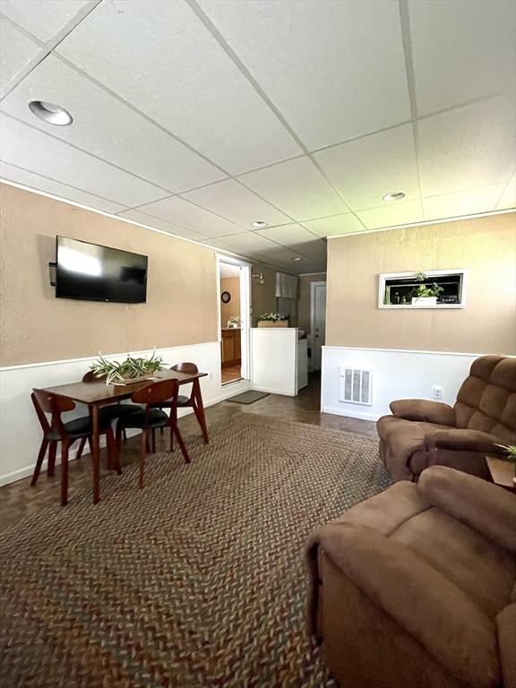1107 Allen Street Springfield, MA 01118 - Photo 4 of 16 a living room with furniture and a flat screen tv