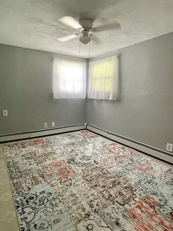 1107 Allen Street Springfield, MA 01118 - Photo 10 of 16 a view of empty room with window and ceiling fan