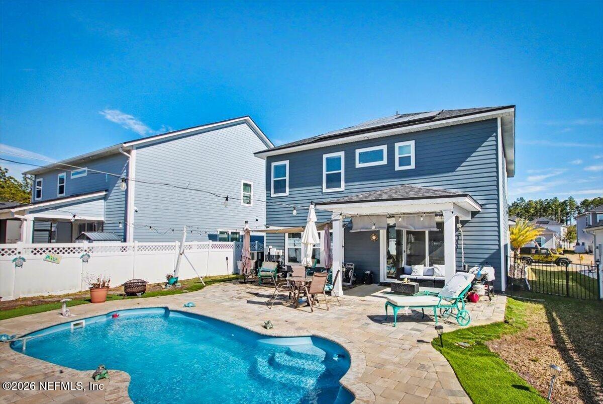 55 Seton Court St. Augustine, FL 32092 - Photo 2 of 10 a view of a house with backyard swimming pool and sitting area