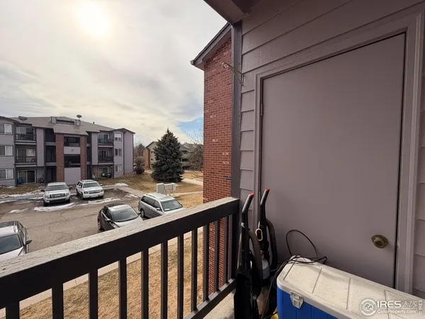 a view of balcony with furniture