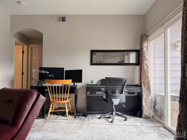 a work room with furniture and windows