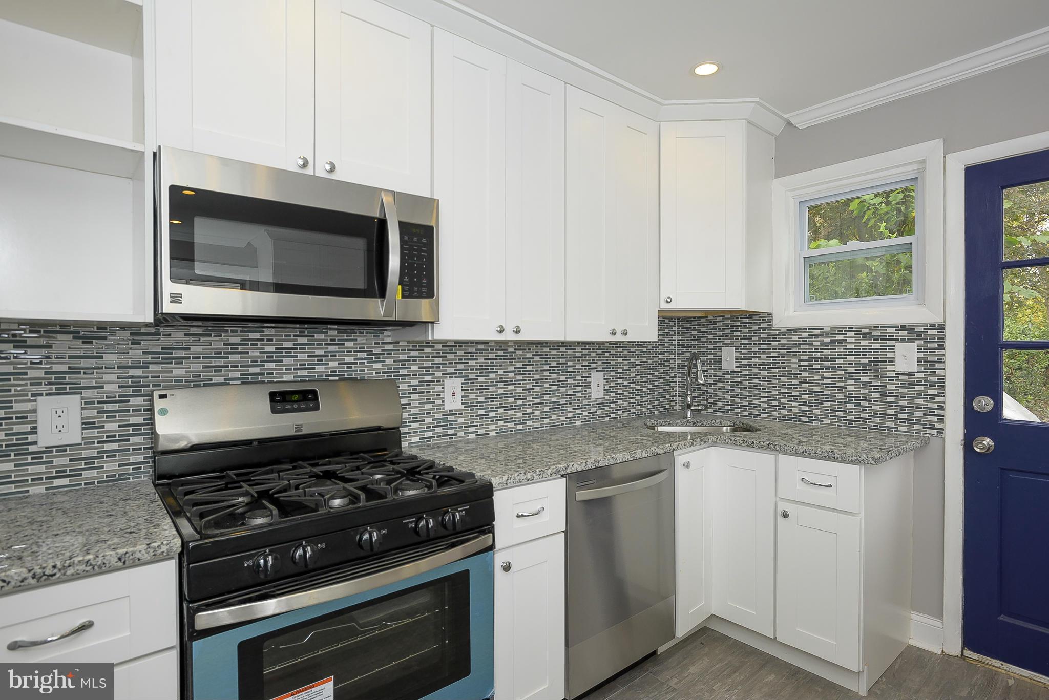 12010 Bluhill Road Silver Spring, MD 20902 - Photo 8 of 30 Kitchen with Custom Backsplash