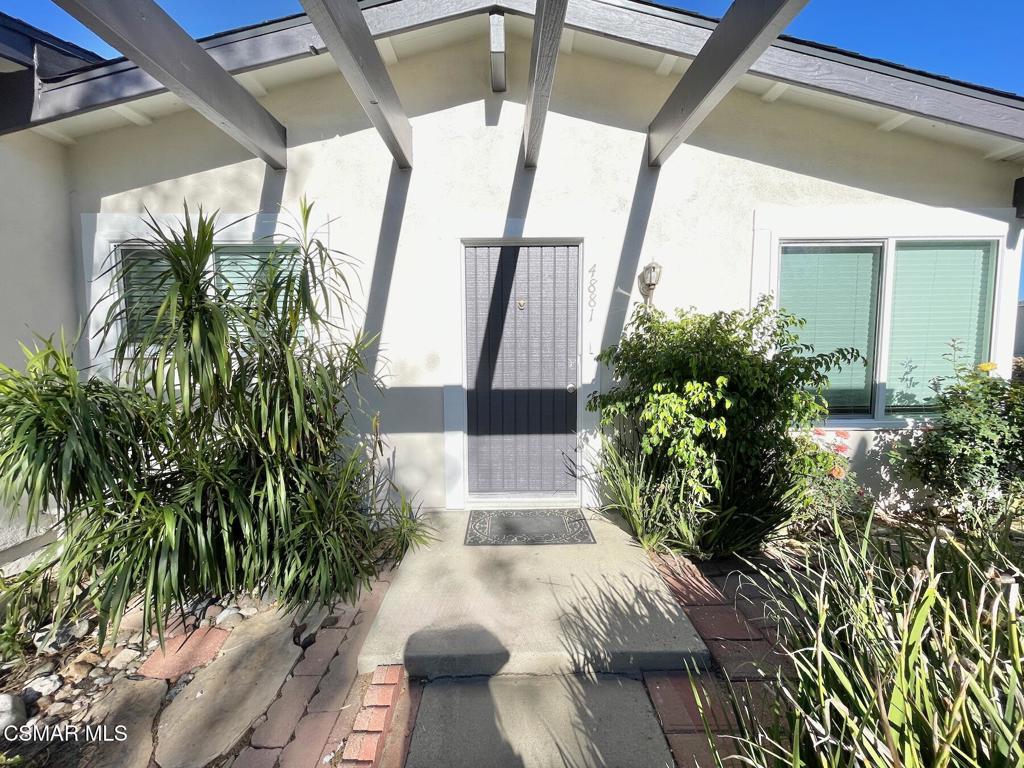 a view of yard from deck with outdoor seating