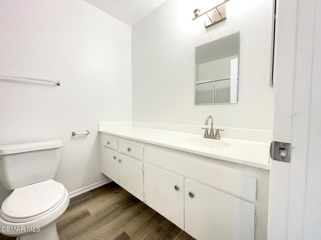 4881 Muirwood Court Simi Valley, CA 93063 - Photo 11 of 32 a bathroom with a toilet sink and mirror