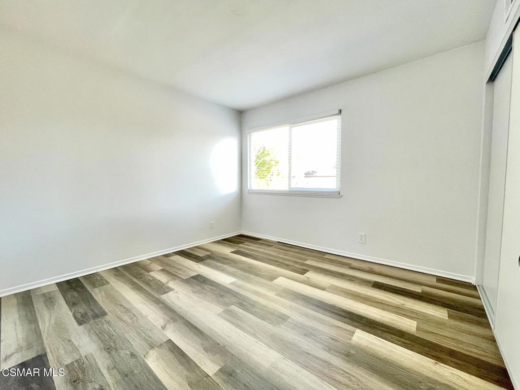 4881 Muirwood Court Simi Valley, CA 93063 - Photo 12 of 32 a view of a room with wooden floor and window