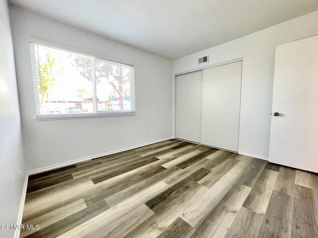 4881 Muirwood Court Simi Valley, CA 93063 - Photo 13 of 32 a view of a room with wooden floor and window