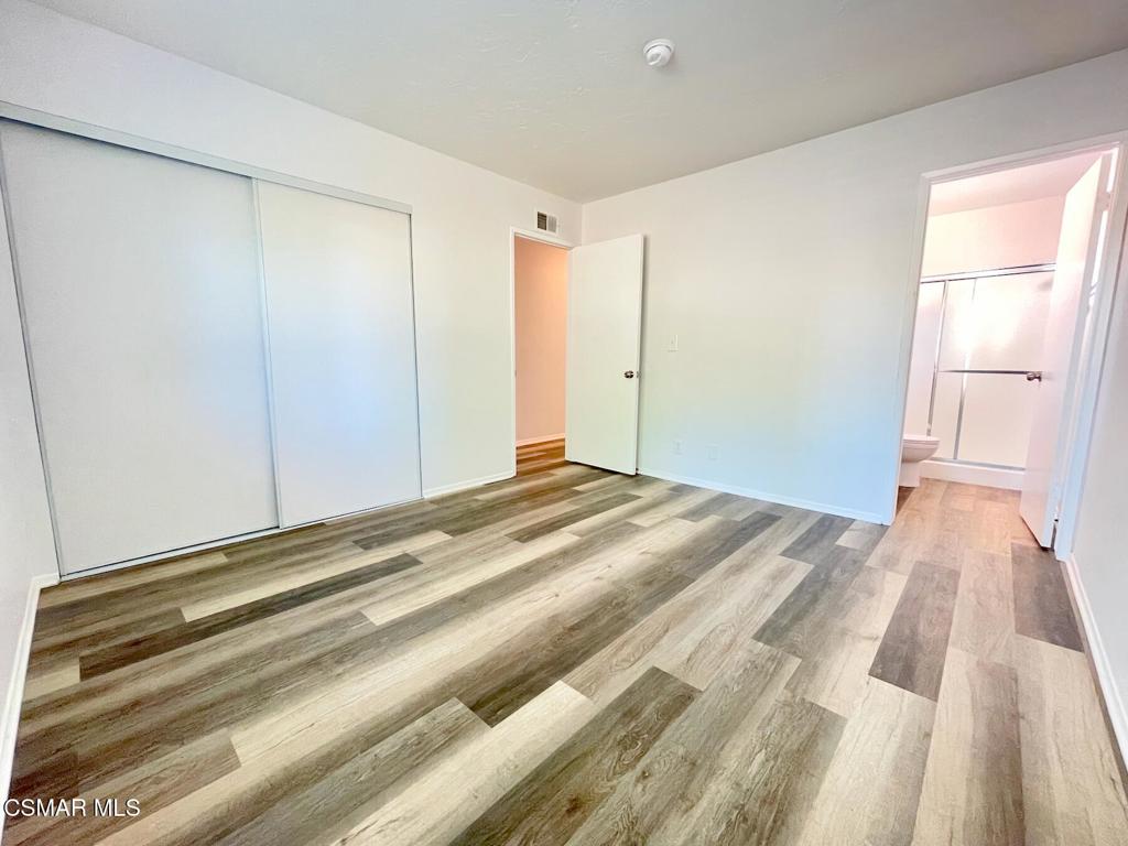 4881 Muirwood Court Simi Valley, CA 93063 - Photo 16 of 32 a view of a room with wooden floor
