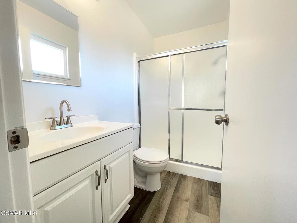 4881 Muirwood Court Simi Valley, CA 93063 - Photo 17 of 32 a bathroom with a sink a toilet a shower and a mirror