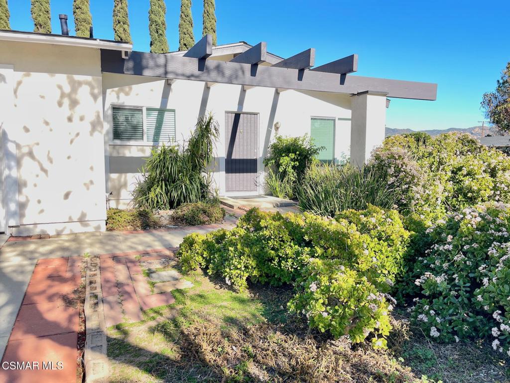 4881 Muirwood Court Simi Valley, CA 93063 - Photo 2 of 32 a front view of a house with a yard